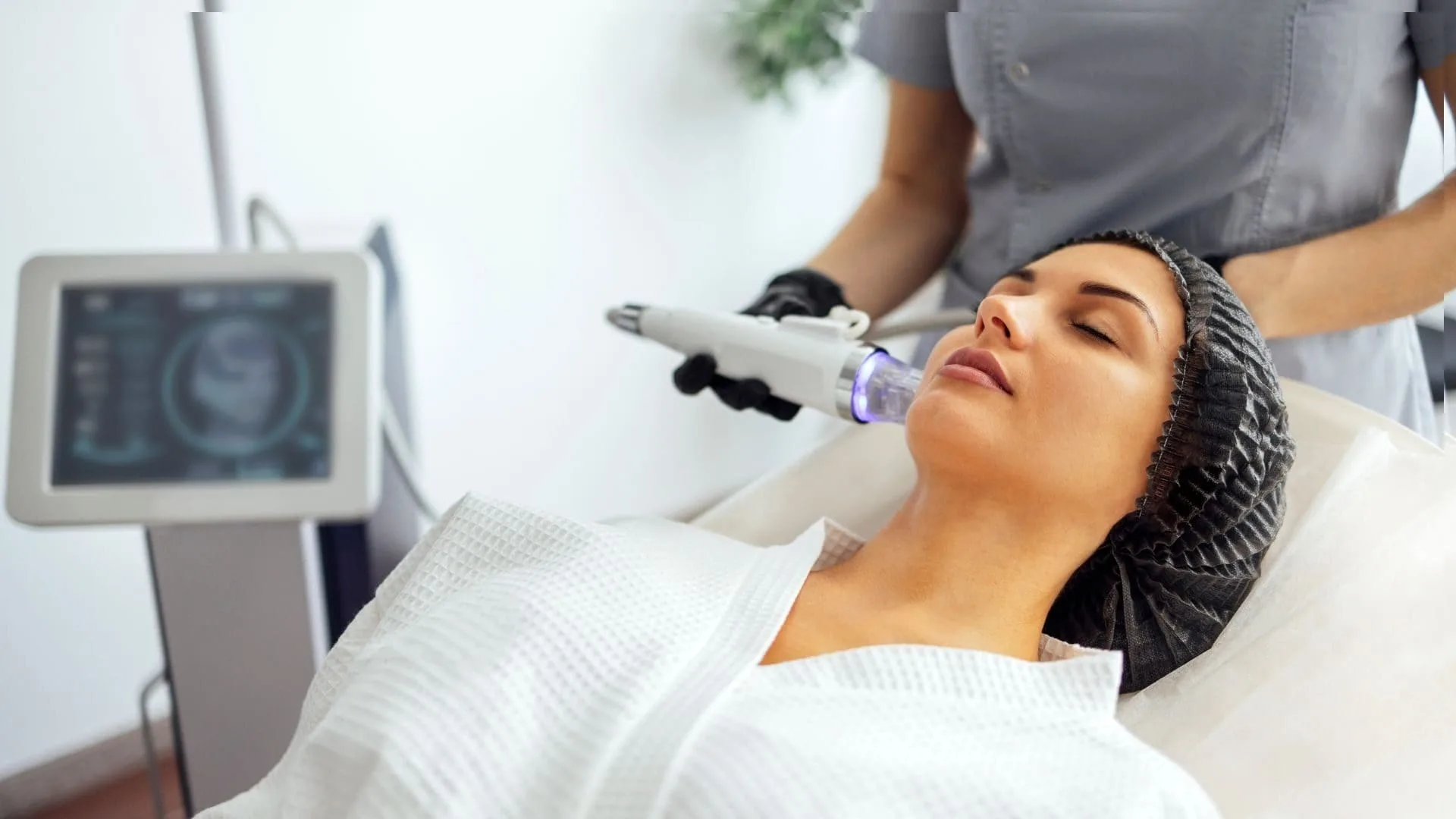 RF microneedling handpiece on the Lutronic Genius being applied to a patient's face at Medrein Health in Southlake, TX